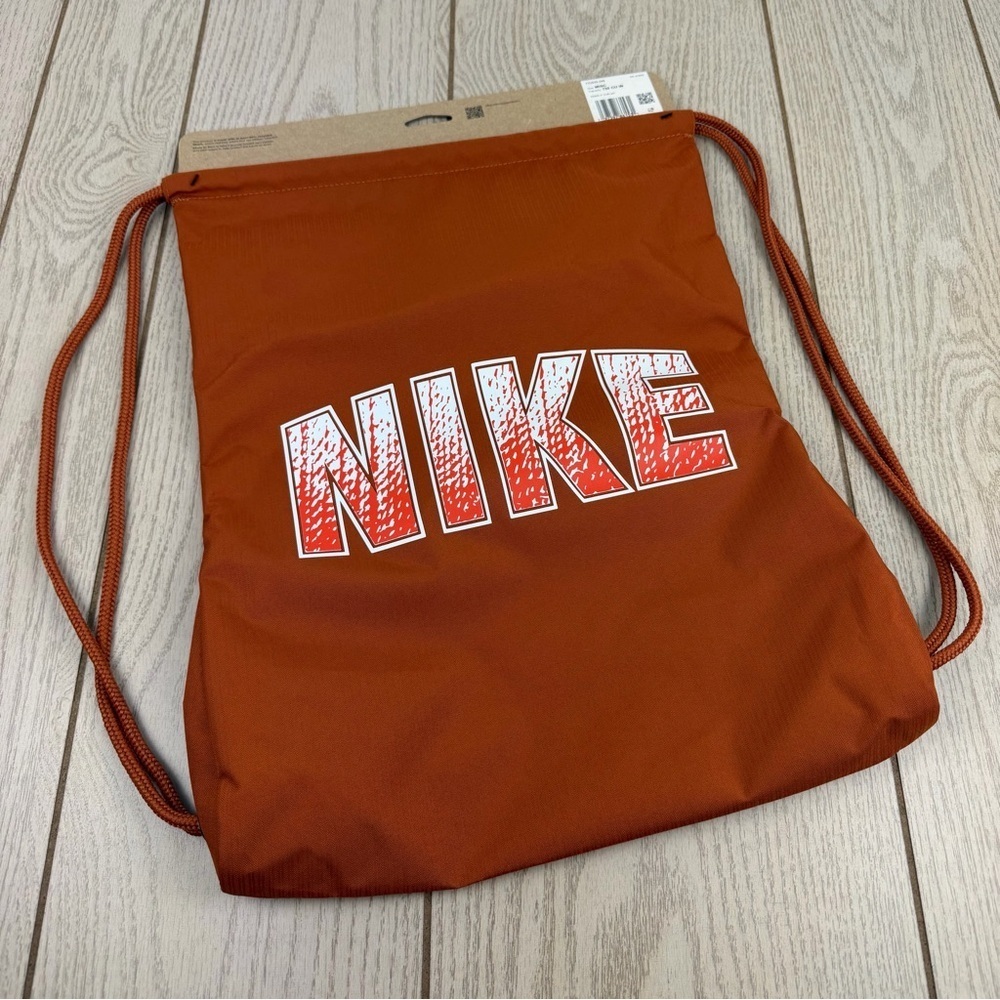 Nike Kids Drawstring Bag (12L) One Size Medium Orange Ombre Graphic $21